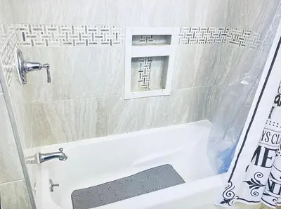 a bathroom with a bath tub with a shower curtain at NYC Cozy Private Bedroom with Free Parking & Near Subway - Business & Tourists in Van Nest