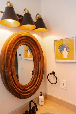 a bathroom with a wooden mirror and a sink at Lake Naomi Chalet - 2hrs from NYC in Pocono Pines