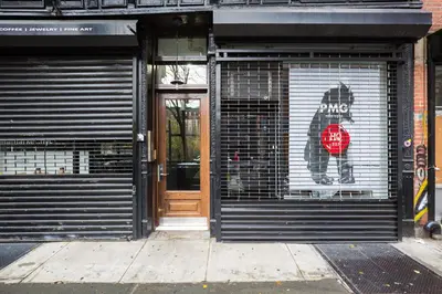 a door of a store with a dog painted on it at Nolita 1br w wd nr New Museum NYC-1037 in New York