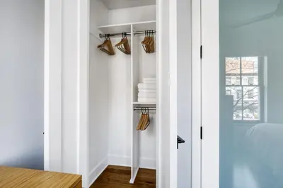 a room with white walls and a closet with hangers at West Village 3br w wd nr Pier 46 NYC-1098 in New York