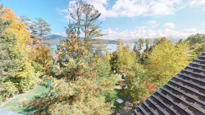 an overhead view of trees and a lake at Cayuga Lodge South in Cooperstown