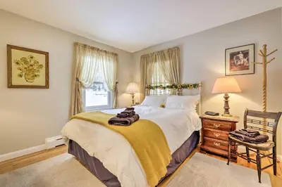 a bedroom with a large bed and a window at Hadley Vacation Rental 24 Mi to Springfield! in Hadley