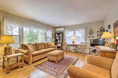 a living room with a couch and a table at Hadley Vacation Rental 24 Mi to Springfield! in Hadley