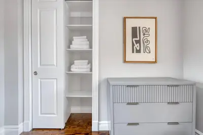 a white room with a white door and a shelf at UES 3br penthouse w wd nr Central Park NYC-1110 in New York