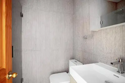 a bathroom with a white toilet and a sink at Nolita 2br w wd nr SoHo NYC-992 in New York
