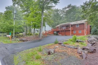 a house on a road in front of a house at Pocono Vacation Rental with Game Room! in Tobyhanna