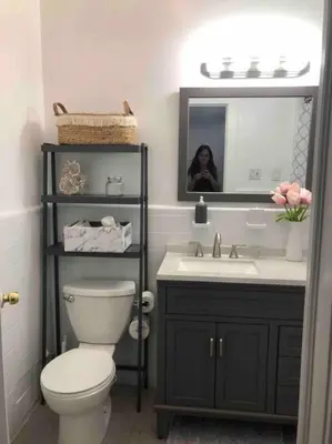 a bathroom with a toilet and a sink and a mirror at Private Rooms in TownHouse w Shared Baths Qn Bed 1-3ppl in Unionport