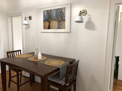 a dining room table with two candles on it at Private Rooms in TownHouse w Shared Baths Qn Bed 1-3ppl in Unionport
