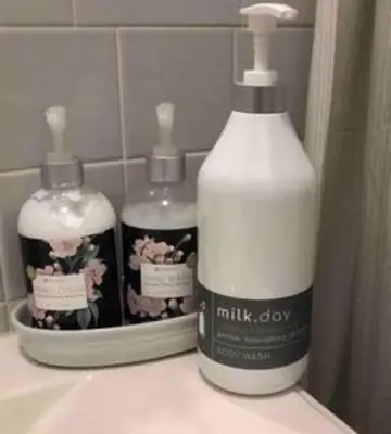 two bottles of moisturizers sitting on a bathroom sink at Private Rooms in TownHouse w Shared Baths Qn Bed 1-3ppl in Unionport