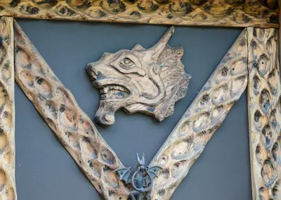 a piece of art with a dragon head on a wall at Vikings Villages Resort in Guilford