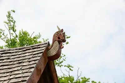 a statue of a dragon on top of a roof at Vikings Villages Resort in Guilford