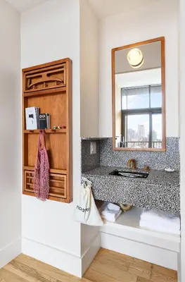 a bathroom with a sink and a mirror at UNTITLED at 3 Freeman Alley in New York