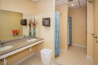 a bathroom with two sinks and a shower at Mountain Village 5H Unit A in Dover