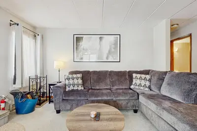 a living room with a couch and a table at Mountain Village 5H Unit A in Dover