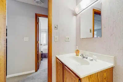 a bathroom with a sink and a mirror at Mountain Village 5H Unit A in Dover