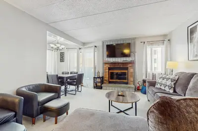 a living room with a couch and a fireplace at Mountain Village 5H Unit A in Dover