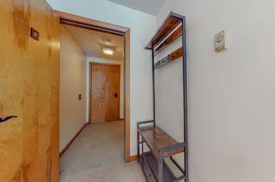 a room with a mirror and a hallway at Mountain Village #5H in Dover