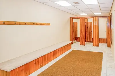 an empty room with a bench and a rug at Mountain Village 5H Unit B in Dover