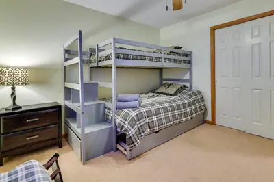a bedroom with a bunk bed and a closet at Hot Tub, Game Room! Poconos Home 22 Mi to Slopes in Gouldsboro