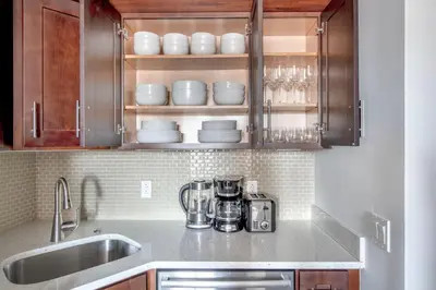 a kitchen with a sink and a counter top at UES 2br w wd gym doorman nr Cooper Hewitt NYC-1117 in New York