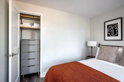 a bedroom with a bed and a closet at UES 2br w wd gym doorman nr Cooper Hewitt NYC-1117 in New York