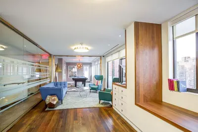 an office with a waiting room with a table and chairs at UES 2br w wd gym doorman nr Cooper Hewitt NYC-1117 in New York
