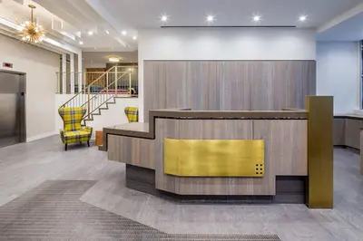 a lobby with a reception desk and chairs at UES 2br w wd gym doorman nr Cooper Hewitt NYC-1117 in New York