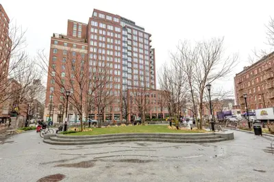 a park in the middle of a city with tall buildings at W Village 1BR w Elevator WD nr subway NYC-762 in New York