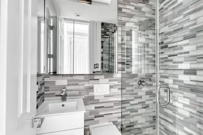 a bathroom with a toilet and a sink and a mirror at W Village 1BR w Elevator WD nr subway NYC-762 in New York