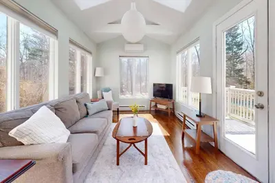 a living room with a couch and a table at White Oaks in Branford