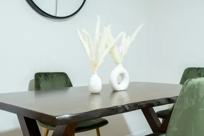 two white vases on a wooden table with green chairs at 49-4A Prime Midtown newly 2BR WD in New York