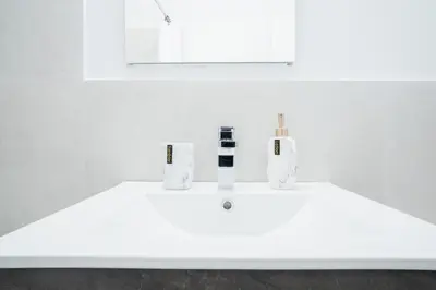 a white sink with two bottles on top of it at 49-4A Prime Midtown newly 2BR WD in New York