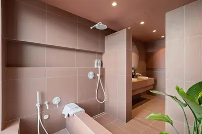 a bathroom with a shower and a sink at 4BR Greenpoint Duplex Noorman by RoveTravel in Brooklyn
