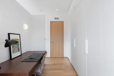 a home office with a desk and a door at 4BR Greenpoint Duplex Noorman by RoveTravel in Brooklyn