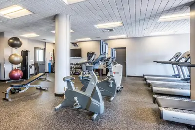 a fitness room with treadmills and cardio equipment at UWS 1BR w Doorman Gym Parking nr Central Park NYC-596 in New York
