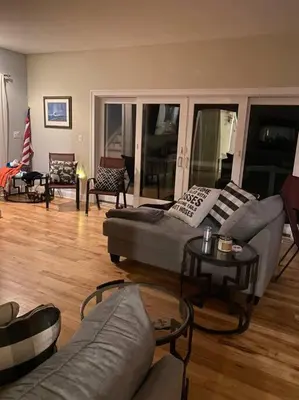 a living room with a couch and a table at A little place in the Sun in Milford