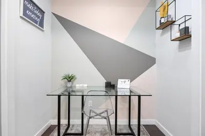 a glass table and a chair in a room at SWJ 1st - Near Most Attractions Walk to Train Times Sq near in New York