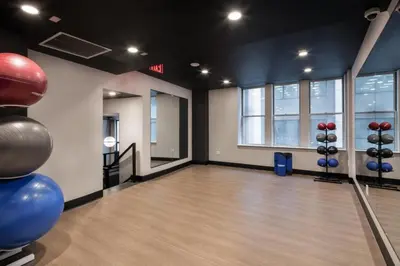 a bowling alley with balls and pins in a gym at FiDi 1br w lounge gym nr Freedom Tower NYC-1138 in New York