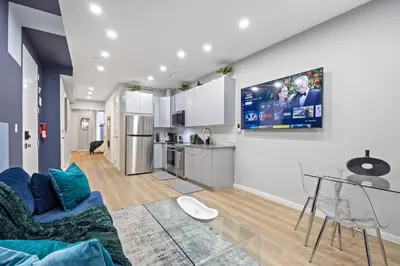 a living room with a couch and a table at SWJ G - Save on 2Day or more Stays 25min to Times Sq in New York
