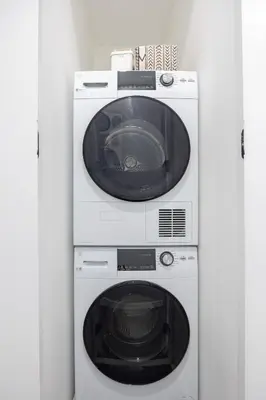 a washing machine and a dryer in a room at SWJ G - Save on 2Day or more Stays 25min to Times Sq in New York