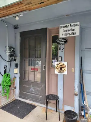 a black door of a building with a sign on it at Rock Pad for Yale, Visitors, Nurses, Staff in New Haven