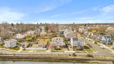 an aerial view of a town with houses and a river at Gorgeous Waterfront 2 Bedroom 1 Bath Modern Home. in New Haven