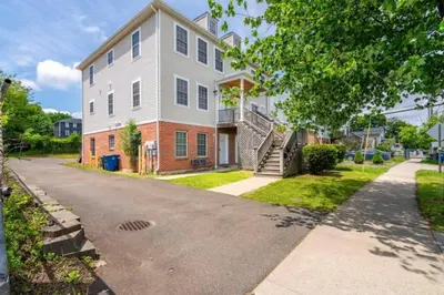a large house with a driveway in front of it at Gorgeous Waterfront 2 Bedroom 1 Bath Modern Home. in New Haven