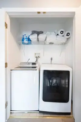 a white microwave and a television in a room at Gorgeous Waterfront 2:1 - 2 houses in 1 building. in New Haven