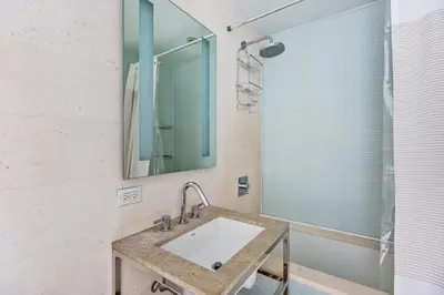 a bathroom with a sink and a mirror at Midtown 1br w doorman gym wd nr Rock Center NYC-1127 in New York