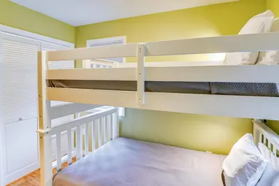 a bunk room with two bunk beds in it at Saratoga Springs Vacation Rental with Lake Views! in Saratoga Springs