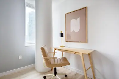 a desk and a chair in a room at Midtown 1br w doorman gym wd nr Rock Center NYC-1131 in New York