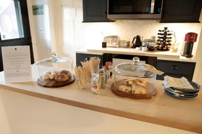 a kitchen counter with bread and pastries on it at The Yarra in Roscoe