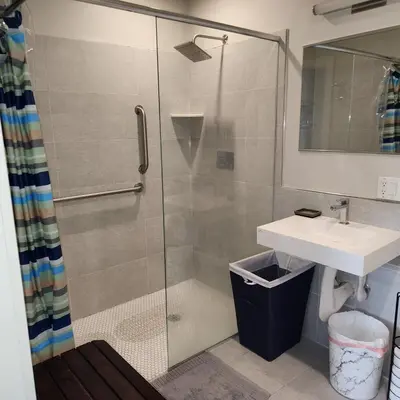 a bathroom with a shower and a sink at Beacon Hotel in Beacon