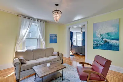 a living room with a couch and a table at Spacious Historic Home in the Berkshires! in Pittsfield